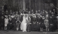 The witness as a child at a wedding, fifth from the left