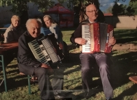 Cholina Parish Day, the witness playing the accordion with parish priest M. Mališka