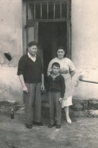 With parents, 1957