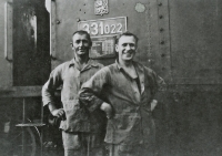 At the railway station in Zohor, Slovakia. On the left Mr. Zajíček, a shoemaker, on the right Father Lev Vilč, ca. 1930s