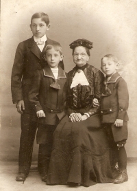 Father Emil Dukát with grandmother and younger brothers Eduard and František