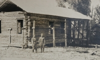 Vladimír Ficek on the left, circa 1948, in the Soviet army, in front of the log cabin he built