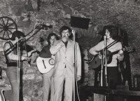 Frantisek Vlček in the foreground by the microphone with the band Křováci, 1970s