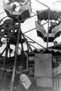Anna Macečková's daughters and nephew on a carousel