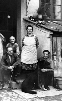 Anna Marková's mother, left grandfather and father in front of the house with a shop and glassworks in Vrbno pod Pradědem