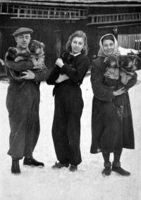 Anna Marková in the middle with her mother and father in the yard of their house in Vrbno pod Pradědem