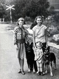 Anna Marková on the right on the road before crossing the railway siding in Vrbno pod Pradědem, 1950s