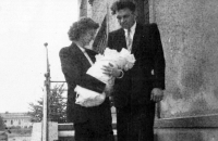 With mother and father at christening