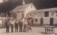 Father Antonín Lehečka (third from left) in front of blacksmith´s workshop with his apprentices and wheelwrights