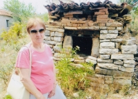 Eftichia Kiprovská in front of the only building from her youth - a bread oven, in the village of Vrondero, where she comes from