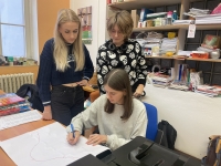 A team from the JAK Louny Primary School creates materials for a radio script, January 2024