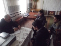 Volodymyr Kondur consults a Roma family on obtaining documents. Korsuntsi village, Odesa region, 2015