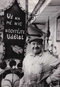 Antonín Lehečka, blacksmith and shoemaker, with a handmade and telling sign