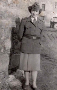 Anna Novotná in her brother's military uniform; 1950s