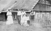 Grandmother Anežka Císařová, Amálie Císařová standing behind her and František Císař on the right