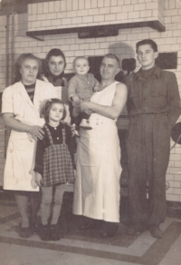 Zdeněk Beran with his family in the bakery owned by his father; left to right: witness's mother, younger sister Marie, older cousin Anna, nephew Milan, father and witness, 1947