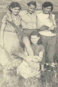 With friends in the field picking flax