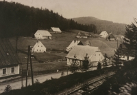 Bučnice cottages of the Siegel, Pasler, Stenzel, Scholz, Rücker, Leppelt and Weisser families as seen from the railway line towards the forest