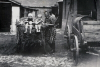 Parents of Arnošt Vošahlík with their grandchildren on the farm in Buk near Milín, 1970s