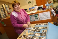 Anna Šauerová during the preparation of the exhibition for the anniversary of the theatre, 2018