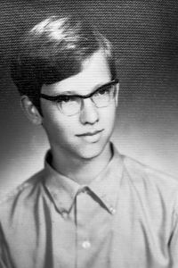 On the photo from his ID card, 1971