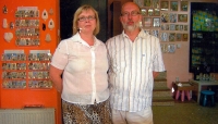 Michal Holeček with his second wife Eva in front of his own bookstore AVE in Uherské Hradiště, 2013
