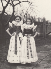 Witness Libuše Janková with a friend wearing a Haná folk costume, 1956-1958