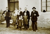 The Lausecker family - from left: uncle Karel with accordion, sister Anna, mother with Maruška, František, Emma, father, grandfather Václav, 1943