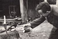 Bedřich Michalec with a tamed magpie while in the military, Cheb, 1969