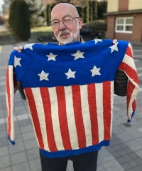 Michal Holeček with a sweater that his mother knitted for him in the 1970s according to a photograph in the American magazine Spectrum, Zlín, 2025