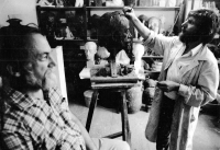 Gotthard Janda modelling a bust of his friend Miloš Kačírek
