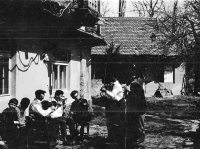 Gotthard Janda wearing glasses with a violin at the wedding of his classmate Josef Uprka's sister in Hroznová Lhota