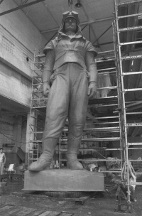 The photo is from a series of photographs documenting the creation of a new statue of Milan Rastislav Štefánik. The original from Bohumil Kafka's sculpture studio was destroyed by the communist regime in Bratislava in 1953. The creation of the copy was led by Gotthard Janda