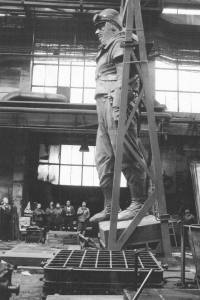 The photo is from a series of photographs documenting the creation of a new statue of Milan Rastislav Štefánik. The original from Bohumil Kafka's sculpture studio was destroyed by the communist regime in Bratislava in 1953. The creation of the copy was led by Gotthard Janda
