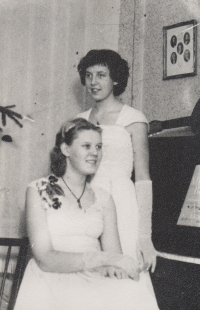 The witness (seated) with her sister Anna, who later became a music teacher