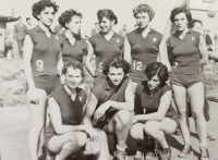 Olga Fikotová with basketball players, bottom centre, 1950s
