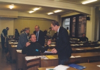 Peter Morée sitting in the front in an interview with the Dean of the Evangelical Theological Faculty Jakub Trojan, 1998
