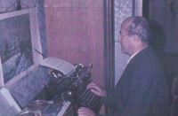 Father at a typewriter, early 70s