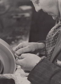 Father's hands grinding glass for glasses, before 1959