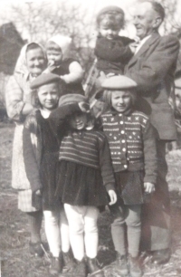 Grandfather František Pilař from Křižanovice No. 8, born in 1888, and grandmother Anna Pilařová with grandchildren: Vlasta Smetánková on the right, 1953, Křižanovice