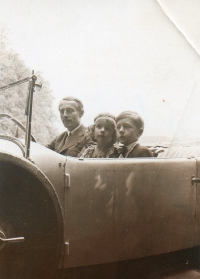 Grandfather Mikuláš, a passionate motorist, with witness's mother Eleonora and her brother Adam, 1930s