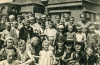 A trip to Sněžka organised by the Sokol in Semily, the patron municipality of war-torn Uhlířov, for the local children in 1946. Josef Prejda is standing in the middle row, second left, wearing a grey jacket and a white shirt with a collar