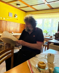 Karel Pořízka in his pub during an oral history event in Bousín