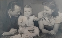 With her parents on her first birthday; 1951