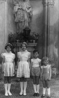 Petr Dujka with siblings during his sister Monica's first Holy Communion, circa 1957
