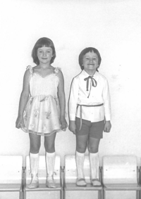 With her brother, 1983