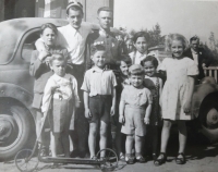 Věra Vašků (girl in polka dot dress) with a Soviet soldier in May 1945