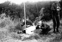Václav Dosoudil photographs a monitor of a Soviet-made portable Shilelis television. A special handmade tube is being used to block out the daylight. Rügen, late 70s/early 1980s