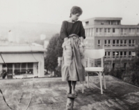 Radmila Chovancová on the roof of a rental opposite the Myslivna restaurant, Gottwaldov, ca. 1986 -1987