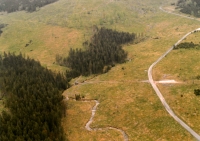 Aerial view of the completely deforested area of the crossing of the Riding Path and the main tributary to the Souš Waterworks Reservoir and the Černá Desná River, May 1996
